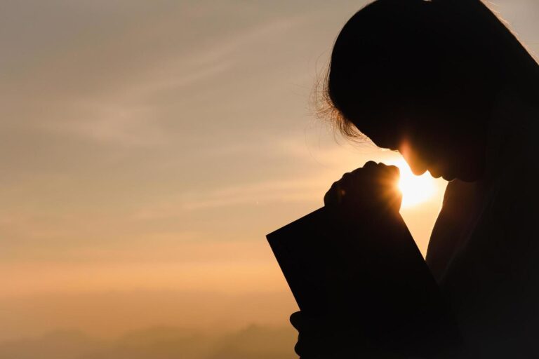 silhouette-of-christian-young-woman-praying-with-holy-bible-at-sunrise-christian-religion-concept-background-free-photo